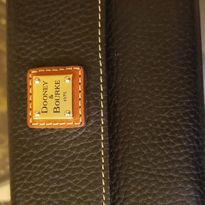 Dooney and Bourke Rich European Pepple grain leather tri fold wallet.